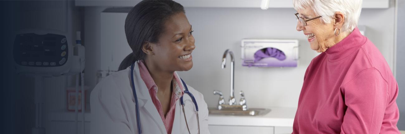 medical provider smiling and looking at a patient